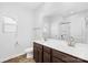 Bright bathroom featuring double sinks and a wide mirror and neutral walls at 7314 Rupell Dr, Charlotte, NC 28273