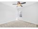 Carpeted bedroom with a ceiling fan and a window at 7314 Rupell Dr, Charlotte, NC 28273