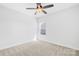 Cozy bedroom featuring carpeted floors, a ceiling fan, and a single window at 7314 Rupell Dr, Charlotte, NC 28273