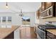 Well-equipped kitchen with stainless steel appliances and a tiled backsplash at 7314 Rupell Dr, Charlotte, NC 28273