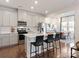 Kitchen island with stainless steel appliances, granite countertops and barstool seating at 828 Blue Canyon Dr, York, SC 29745