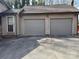 Attached two-car garage with neutral-colored doors and a driveway at 8609 William Wiley Dr, Charlotte, NC 28215