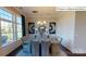 This formal dining room features lots of natural light, hardwood floors, and elegant decor at 1022 Merganser Way, Indian Trail, NC 28079