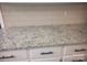 Close-up of white countertop with black hardware at 1041 Cutler Pl, Charlotte, NC 28212