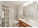 Well-lit bathroom with a shower-tub combo, vanity, and classic fixtures at 113 Burlingame Ct # C, Mooresville, NC 28117