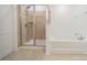 Bathroom featuring a bathtub and stand up shower with glass enclosure at 113 Burlingame Ct # C, Mooresville, NC 28117