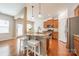 Kitchen featuring stainless steel appliances, stone countertops, and breakfast bar seating at 113 Burlingame Ct # C, Mooresville, NC 28117