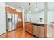 Kitchen featuring stainless steel appliances and bar seating at 113 Burlingame Ct # C, Mooresville, NC 28117