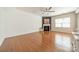Open living room with hardwood floors, fireplace, and lots of natural light at 113 Burlingame Ct # C, Mooresville, NC 28117