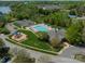 Community pool area with playground, lounge chairs, and meticulous landscaping at 113 Burlingame Ct # C, Mooresville, NC 28117