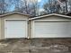 Spacious two-car garage featuring white doors and beige siding, perfect for vehicle storage at 1138 Stateline Rd # 1, Lake Wylie, SC 29710