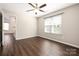 Light-filled bedroom with ceiling fan and wood-look floors and bright natural light at 114 Indian Paint Brush Dr, Mooresville, NC 28115