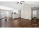 Open dining area with hardwood floors, a kitchen view, and a door to the backyard at 114 Indian Paint Brush Dr, Mooresville, NC 28115