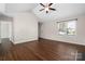 Neutral living room with lots of floor space, vaulted ceiling, and hardwood floors at 114 Indian Paint Brush Dr, Mooresville, NC 28115