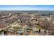 An aerial view showcasing the property and its surroundings with its mature trees and neighborhood at 1140 Knollwood Dr, Claremont, NC 28610