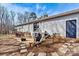 Large backyard with patio, seating, and a grill, perfect for outdoor entertaining, surrounded by trees at 1140 Knollwood Dr, Claremont, NC 28610