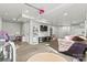 Finished basement area featuring built-in shelves, entertainment center, playroom and painted with light colors at 1140 Knollwood Dr, Claremont, NC 28610