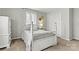 Bedroom featuring four-post bed, natural light, and ample closet space at 1140 Knollwood Dr, Claremont, NC 28610