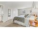 Bright bedroom boasts neutral colors, a modern dresser, and a decorative mirror at 1140 Knollwood Dr, Claremont, NC 28610