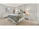 Cozy bedroom featuring a comfortable bed, soft lighting, and neutral colors at 1140 Knollwood Dr, Claremont, NC 28610