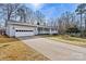 Charming home exterior with a two-car garage, a well-maintained lawn, and inviting curb appeal at 1140 Knollwood Dr, Claremont, NC 28610