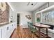 Bright eat-in kitchen area with hardwood flooring and a vintage-style dining set near the window at 1140 Knollwood Dr, Claremont, NC 28610