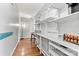 Bright pantry with shelving and hardwood floors, providing ample storage space at 1140 Knollwood Dr, Claremont, NC 28610