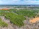 Aerial perspective shows the house set on sprawling acreage with a pond adding natural beauty at 1370 Martin Rd, Hickory Grove, SC 29717