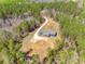 An aerial view showcases the home nestled among lush greenery, providing privacy and a peaceful setting at 1370 Martin Rd, Hickory Grove, SC 29717