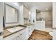 Well-lit bathroom featuring a double sink vanity, cabinets, and a glass-enclosed shower at 1370 Martin Rd, Hickory Grove, SC 29717