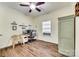 Small bedroom with desk and shelving, ceiling fan and wood-look floors at 1370 Martin Rd, Hickory Grove, SC 29717