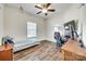 Neutral bedroom featuring a single bed, ceiling fan, a window, and wood-look flooring at 1370 Martin Rd, Hickory Grove, SC 29717