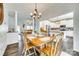 Open dining room with chandelier, hardwood floors, seamlessly connected to the kitchen and living areas at 1370 Martin Rd, Hickory Grove, SC 29717