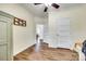 Hallway showing access to other rooms and laundry area, with wood-look floors at 1370 Martin Rd, Hickory Grove, SC 29717