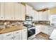 Close-up of kitchen featuring modern appliances, stylish backsplash, and ample cabinet space at 1370 Martin Rd, Hickory Grove, SC 29717