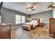 A spacious main bedroom featuring hardwood floors, a ceiling fan, and neutral wall color at 1370 Martin Rd, Hickory Grove, SC 29717