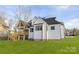 Striking back exterior of a two-story home with a covered deck and yard at 1465 Highcrest Way, Rock Hill, SC 29730