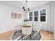 Bright dining room features a glass table, modern chandelier and lots of natural light at 1465 Highcrest Way, Rock Hill, SC 29730