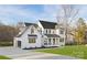 Elegant home featuring a modern garage, well-manicured lawn, black windows and a welcoming front porch at 1465 Highcrest Way, Rock Hill, SC 29730