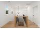 Bright hallway with chandelier and natural wood and iron railing at 1465 Highcrest Way, Rock Hill, SC 29730