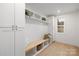 Functional mudroom featuring built-in storage and a bench with a light-filled window at 1465 Highcrest Way, Rock Hill, SC 29730