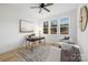 Bright home office featuring large windows, neutral walls, a modern desk, and stylish decor at 1465 Highcrest Way, Rock Hill, SC 29730