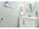 Charming bathroom features a stylish vanity, round mirror, and modern fixtures at 147 Amber Woods Dr, Tega Cay, SC 29708