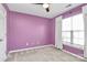 Bedroom featuring great natural light and bright purple walls at 147 Amber Woods Dr, Tega Cay, SC 29708