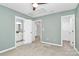 Well-lit bedroom with a ceiling fan and access to a bathroom at 147 Amber Woods Dr, Tega Cay, SC 29708