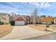 Charming two-story home with brick accents, white garage door, and a well-manicured front yard at 147 Amber Woods Dr, Tega Cay, SC 29708