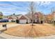 Charming two-story home with brick accents, white garage door, and a well-manicured front yard at 147 Amber Woods Dr, Tega Cay, SC 29708