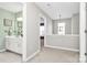 Hallway featuring a clear view to the bathroom and decorative hanging lights at 147 Amber Woods Dr, Tega Cay, SC 29708