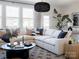 Cozy living room with a large white sectional, decorative pillows, and modern decor at 1500 Levy Way, Charlotte, NC 28205