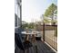 Cozy outdoor patio with a round table, seating, and a view of the backyard and neighborhood at 1500 Levy Way, Charlotte, NC 28205